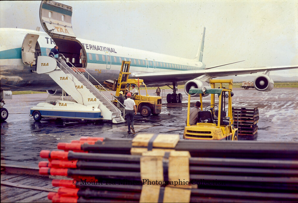 DC8 at Mount Isa airport unloading supplies during flood, June 1975