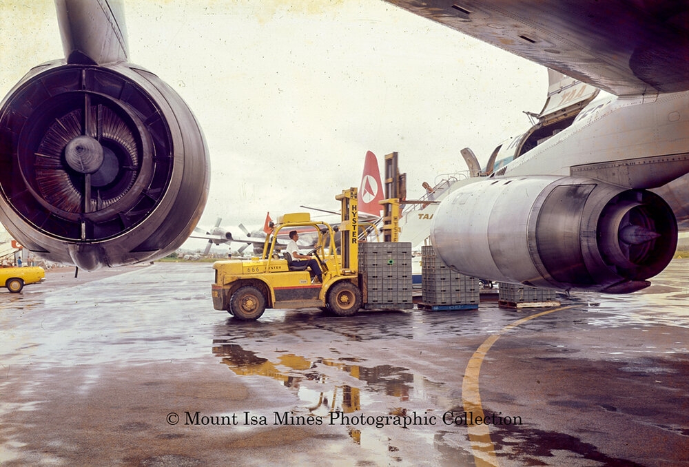 DC8 at Mount Isa airport unloading supplies during flood, June 1975