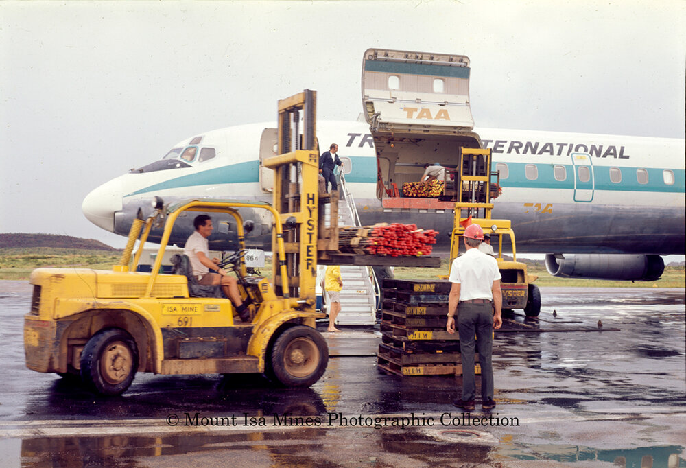 DC8 at Mount Isa airport unloading supplies during flood, June 1975