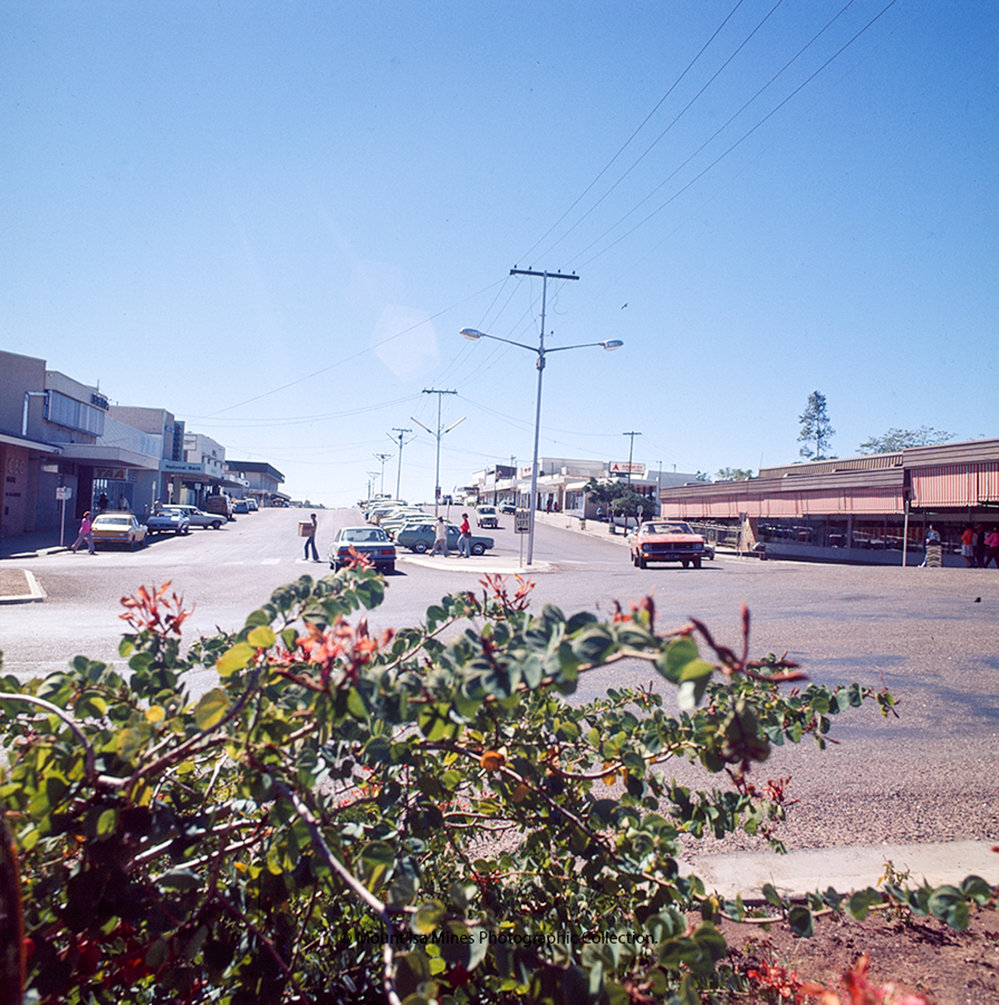 Looking North along Miles Street from Isa Street, c. May 1976 to 1980