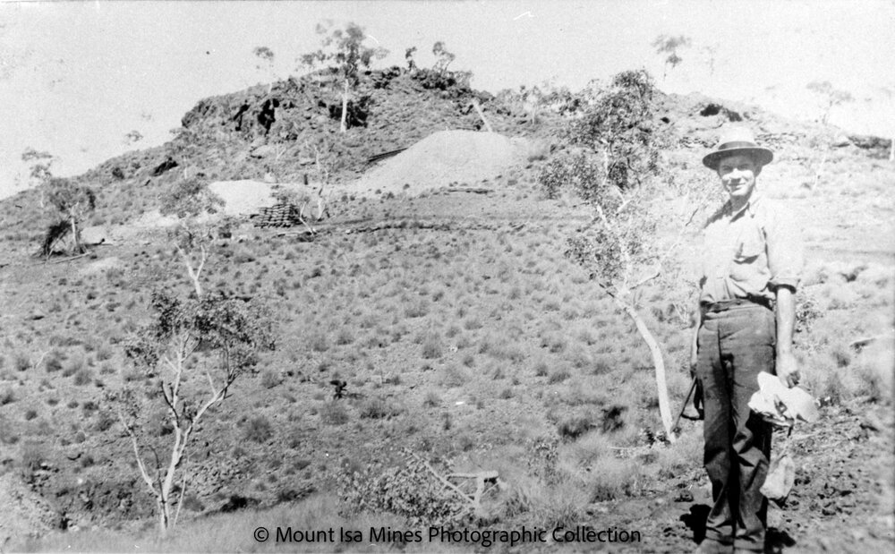 Miner with bagged ore, Mount Isa Mines, c.1964