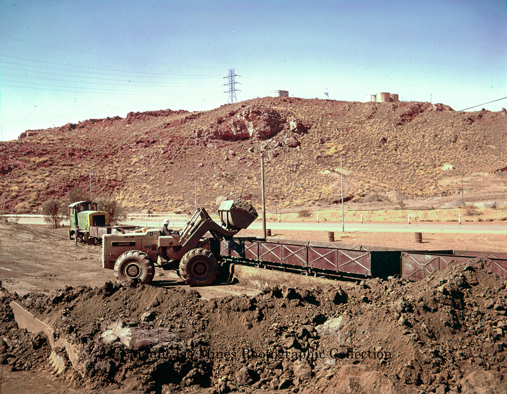 Loading zinc concentrate into railway wagons, Mount Isa Mines