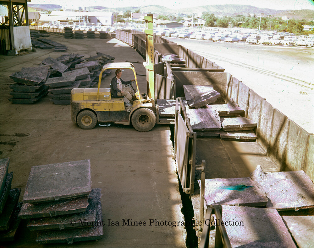 Loading copper into railway wagons, Mount Isa Mines