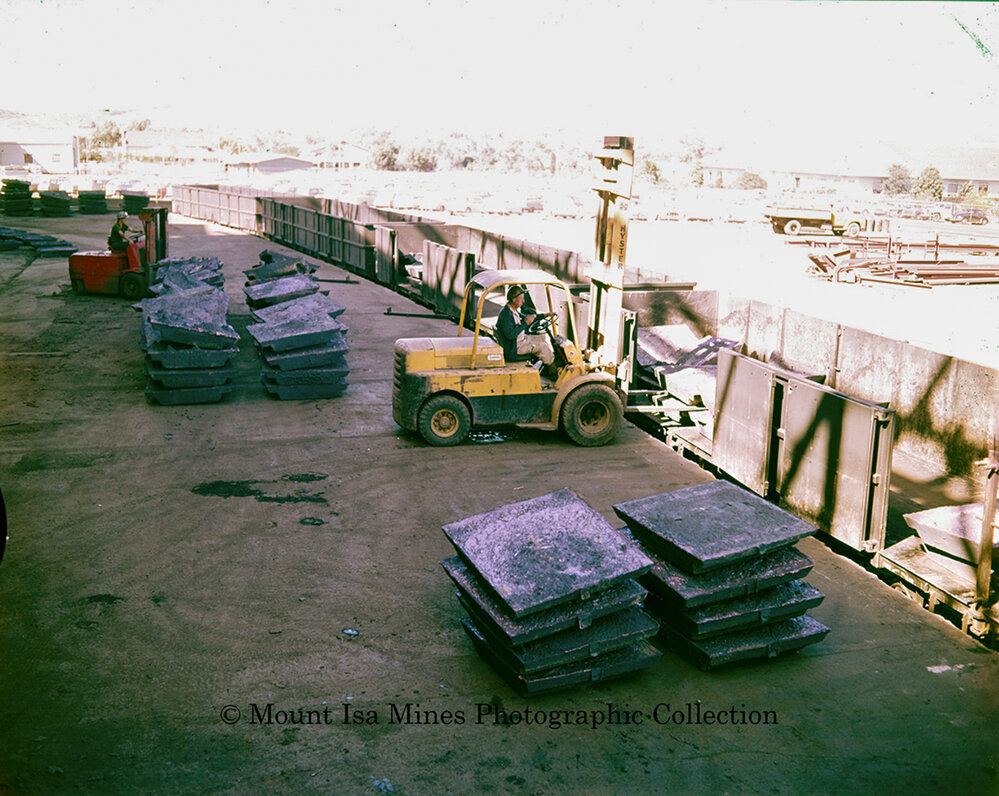 Loading copper into railway wagons at Copper Smelter, Mount Isa Mines