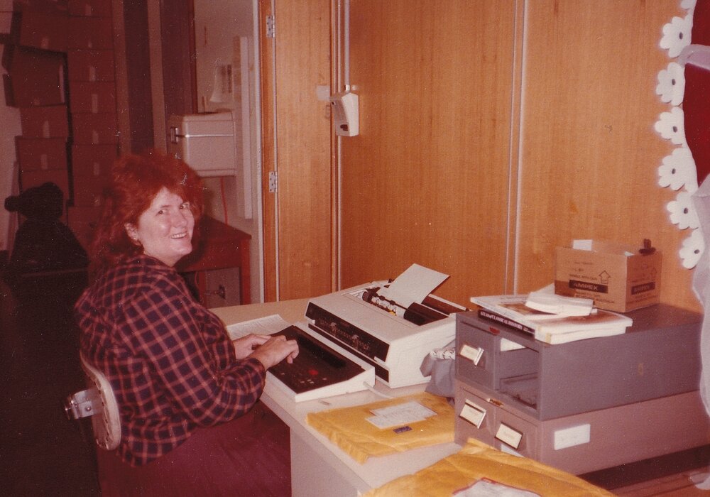 Library staff using typewriter, Mount Isa City Library