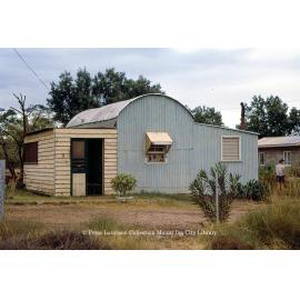 A tin hut on Camooweal Road, Miles End, May 1962