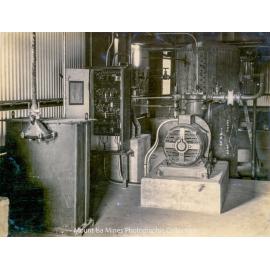 Urquhart Hoist House basement showing air compressor and receiver, Mount Isa Mines, January 1931