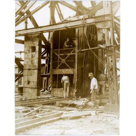 Man and Supply Man Cage and counterweights under construction, Mount Isa Mines, April 1931