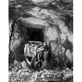 Rail mounted rocker shovel at lead mine, Mount Isa Mines, June 1958