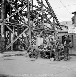 Workers waiting for Man and Supply cage, Mount Isa Mines, January 1959