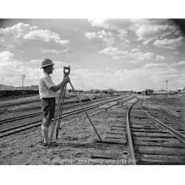 Eric Neville surveying, February 1959