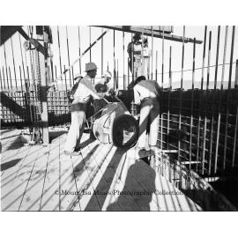Pouring concrete at new Copper Stack, Mount Isa Mines, September 1959