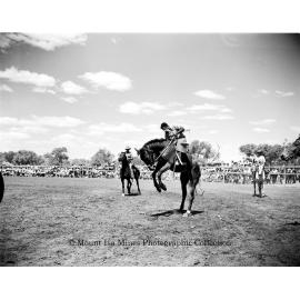 Mount Isa Rotary Rodeo Rough Riding, Spear Creek, September 1959