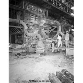 Tapping lead at Lead Smelter blast furnace, Mount Isa Mines, c.1956