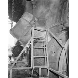 Charging converter with matte at Copper Smelter, Mount Isa Mines, c.1956