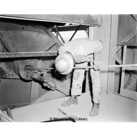 Inspecting disk filter Copper Smelter, Mount Isa Mines, c.1956