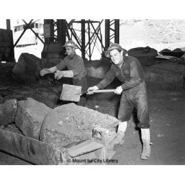 Picking up slag at Copper Smelter, Mount Isa Mines, c.1956