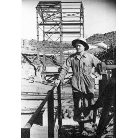 Peter Laurisen with new ore handling construction, Mount Isa Mines, c.1950