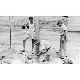 Electrical construction crew erecting a power pole, Mineside, c.1950
