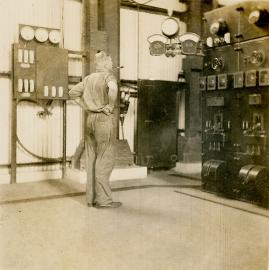Electrician at Diesel Generator Board, Man and Supply 