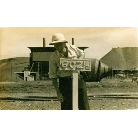 Long way from home, railway mile post at Mount Isa