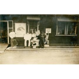 Man standing with first aid contest signs 