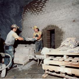 Underground workers building a bulkhead in lead mine, Mount Isa Mines, c.1986