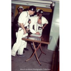 Prince Philip signs visitor log, Mount Isa Mines, April 1970
