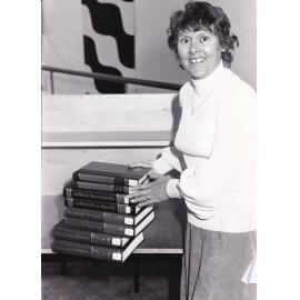 Trudy Zussino with library encyclopedias 