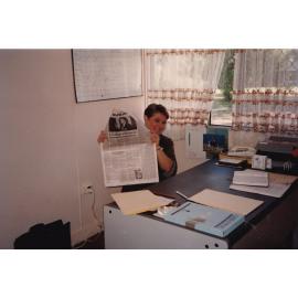 Woman holding newspaper