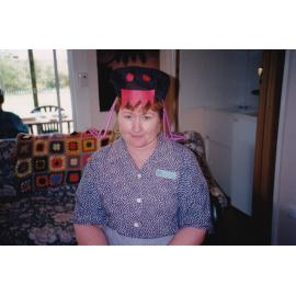 Blue Nursing Service nurse wearing crazy hat