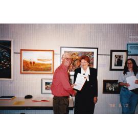 Presenting awards at 75th celebration art event, c.1998