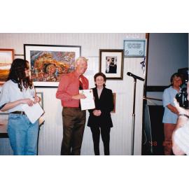 Presenting awards at 75th celebration art event, February 1998