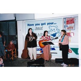 Buskers outside Amcal Chemist, Mount Isa City, August 1998
