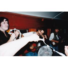 Musicians on train performing, c.1998