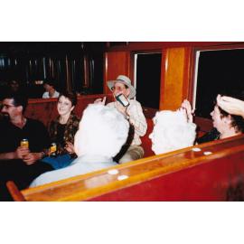 Passengers on train listening to performance, c.1998