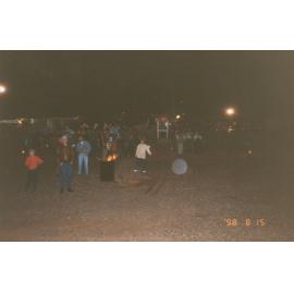 Partygoers at outdoors event, c.1998