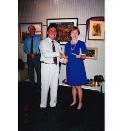 Recipient of award at Civic Centre artwork event, c.1998