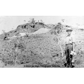 Miner with bagged ore, Mount Isa Mines, c.1964