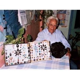 Lapidary Club member with his cabachons & tourmaline crystals, c.1993
