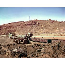 Loading zinc concentrate into railway wagons, Mount Isa Mines