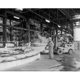 Casting lead blocks into moulds at Lead Smelter, Mount Isa Mines, March 1962