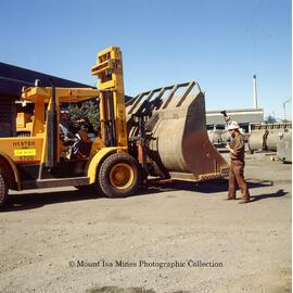 Transport department forklift with loader bucket, Mount Isa Mines