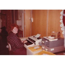 Library staff using typewriter, Mount Isa City Library