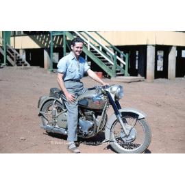 Man on BSA Motorcyle at dormitory, Mineside, c.1956