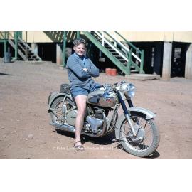 Man on BSA Motorcyle at dormitory, Mineside, c.1956
