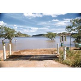 Water over spillway at Transport Bay, Lake Moondarra, March 1962