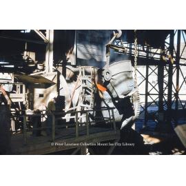 Charging converter with matte from reverberatory furnace at Copper Smelter, Mount Isa Mines, July 1956