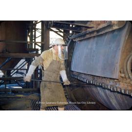 Tuyere punching on converters at Copper Smelter, Mount Isa Mines, c.1956