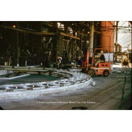 Casting wheel for lead blocks at Lead Smelter, Mount Isa Mines, July 1956